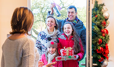 Family delivering presents at christmas. 