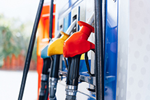 Different colored gas pumps.