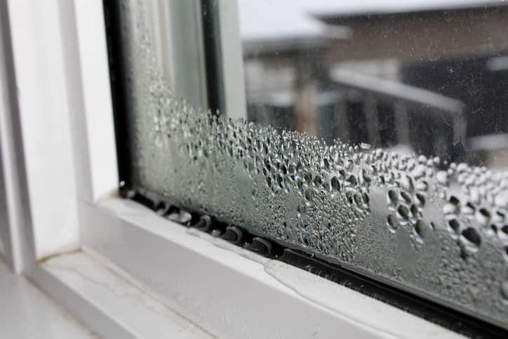 Water forming on the corner of a window.