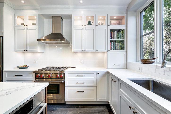 View of a kitchen with nice appliances.
