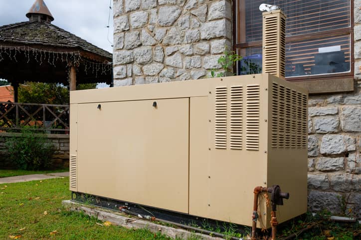 A backup generator on the side of a home.