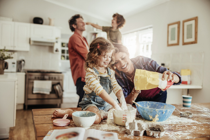 Family in the kitchen baking together. 