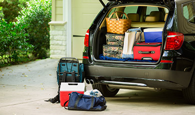 A van packed up full after closing a winter home. 