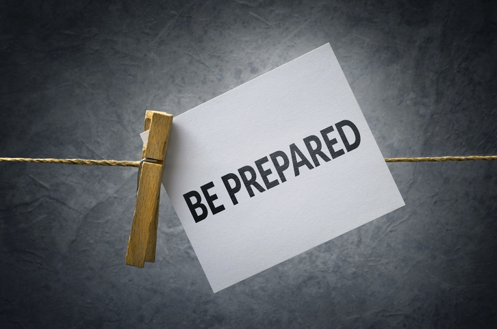 Note card clipped on a string that says Be Prepared.