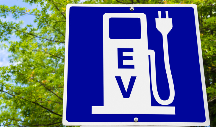 An electric vehicle charging station sign.