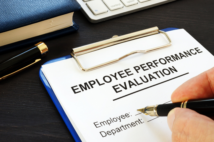 Clipboard with a employee evaluation form attached.