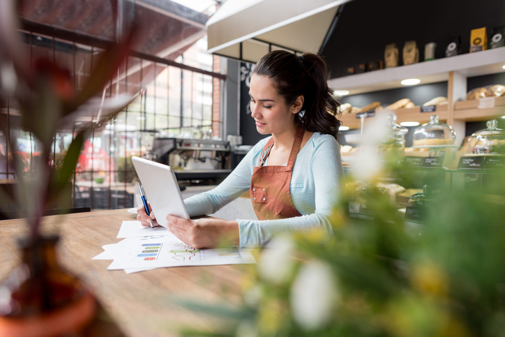 Small business owner using a tablet.