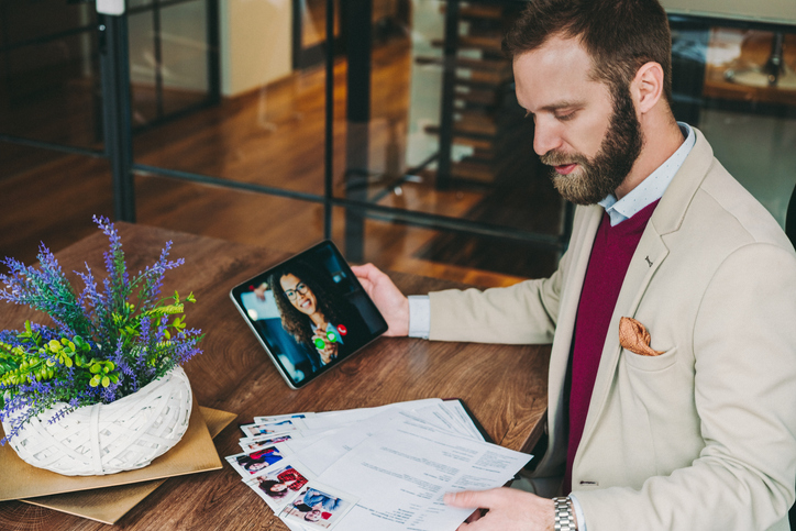 A job recruiter on a zoom video chat with a prospect employee.
