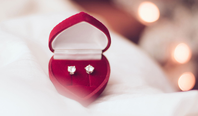 Diamond earrings in a heart-shaped box. 