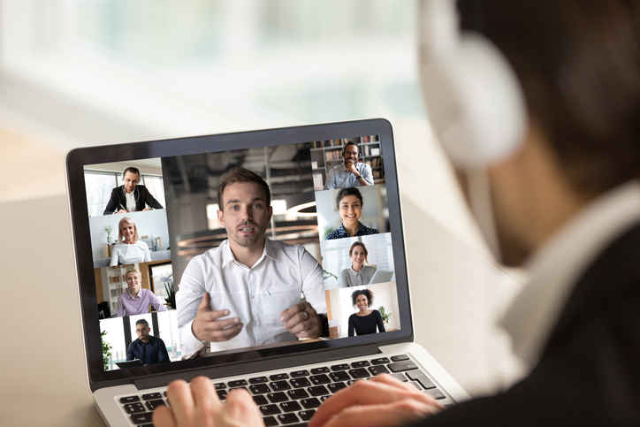 Man attending a video conference call with co-workers.