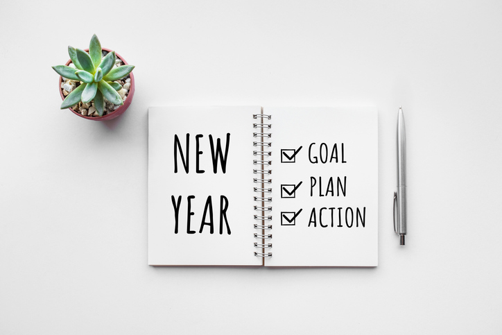 A new planner that has New Year and several goals written.