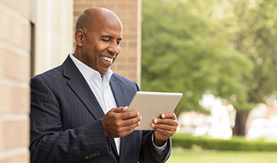 Business man using his tablet. 
