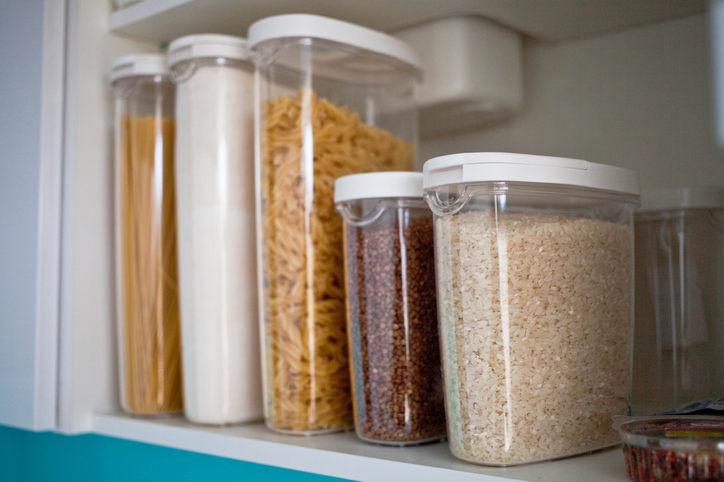 Storage containers in a pantry cabinet.