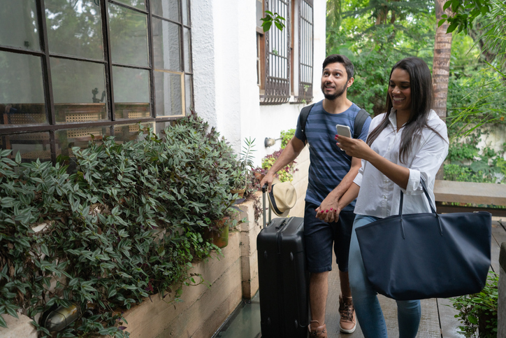 A couple walking up to a rented property.