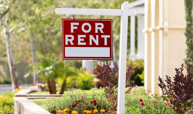 A For Rent sign posted out a residence.