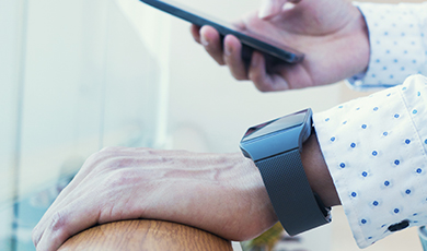 A smartwatch and a smart phone. 