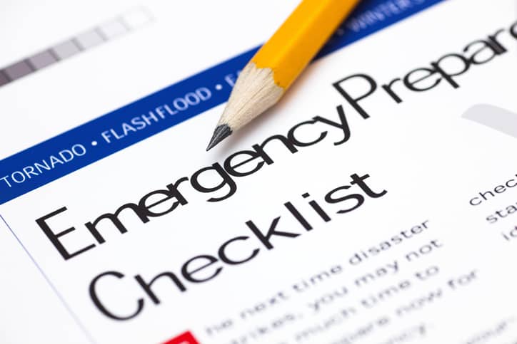 Pencil placed on top of a emergency storm checklist document.