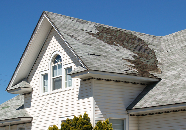 roof of a home with some damaged areas