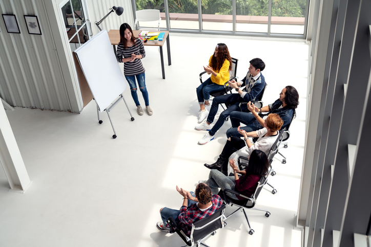 Group of workers attending a meeting.