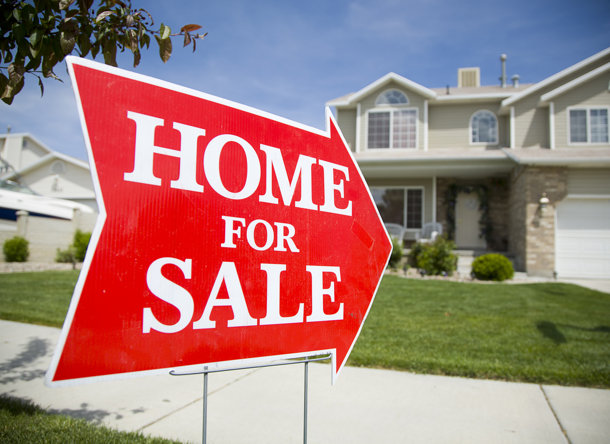 Home for sell sign outside a property.