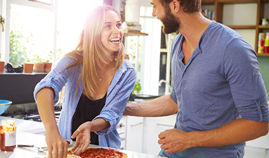 a couple making dinner.