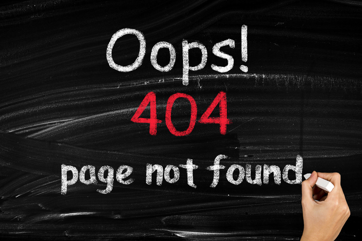 Oops 404 page not found written on a chalkboard.