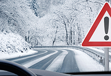 Winter road with caution side. 