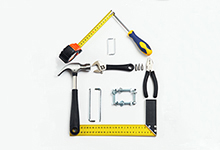 Tools arranged in the shape of a home.