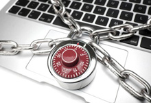 A laptop is pad-locked shut. 