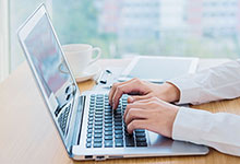 A man working on a laptop. 